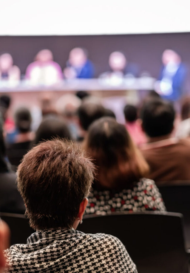 Rear view of Audience in the conference hall or seminar meeting which have Speakers are Brainstorming